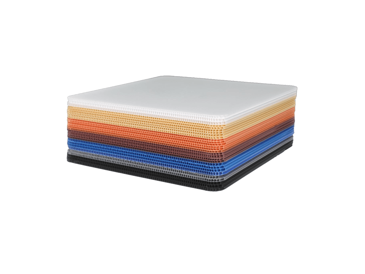 Stack of PP corrugated sheets showing colored hollow flute profiles