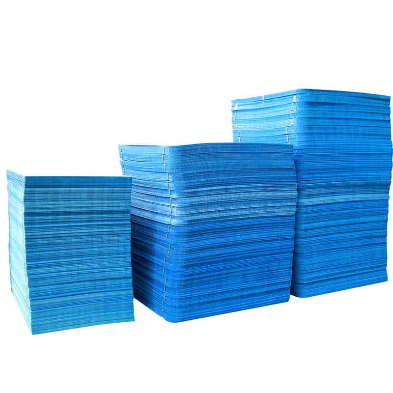 Three neat stacks of blue PP layer pads on a continuous white background